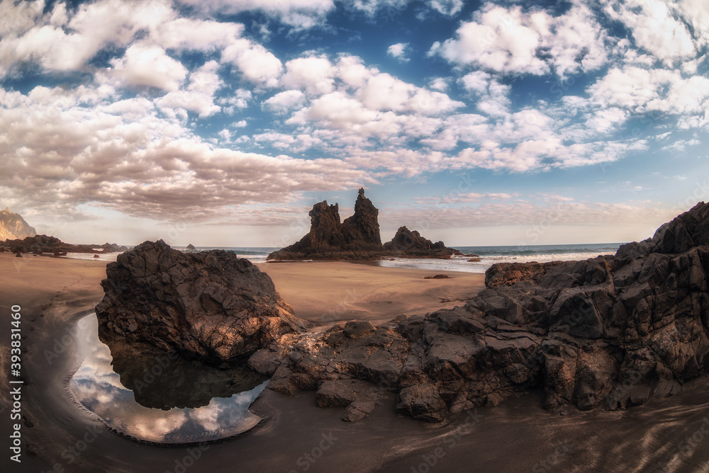 Fototapeta premium landscape of a sandy beach in a sunset and with reflections in the water