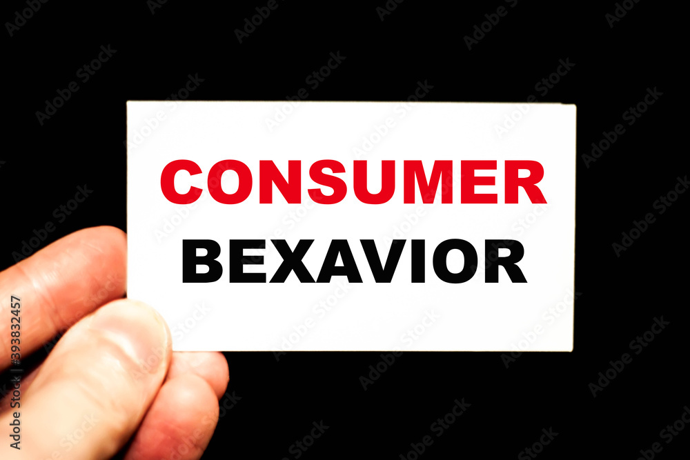 CONSUMER BEHAVIOR. A man's hand holds a business card with the words for business.