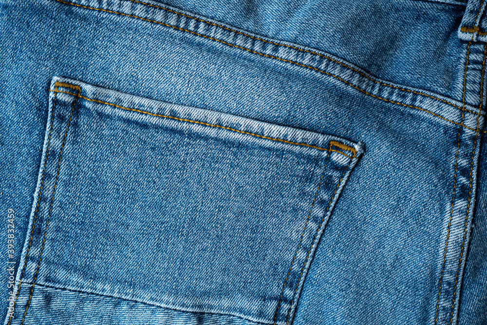 Backside denim blue jeans with pocket for background. Premium quality fabric with perfect seams. Backside denim blue jeans with pocket for background. Premium quality fabric with perfect seams.