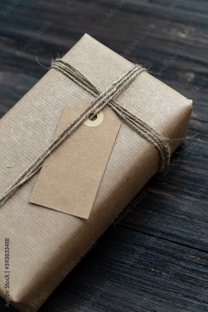 Handcraft christmas present wrapped with recicled craft paper