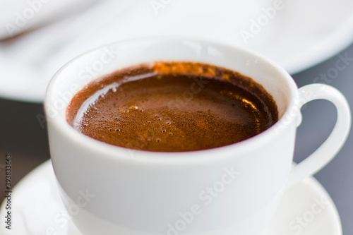 Turkish cup pf coffee, dark coffee close-up and macro, hot aromatic drink