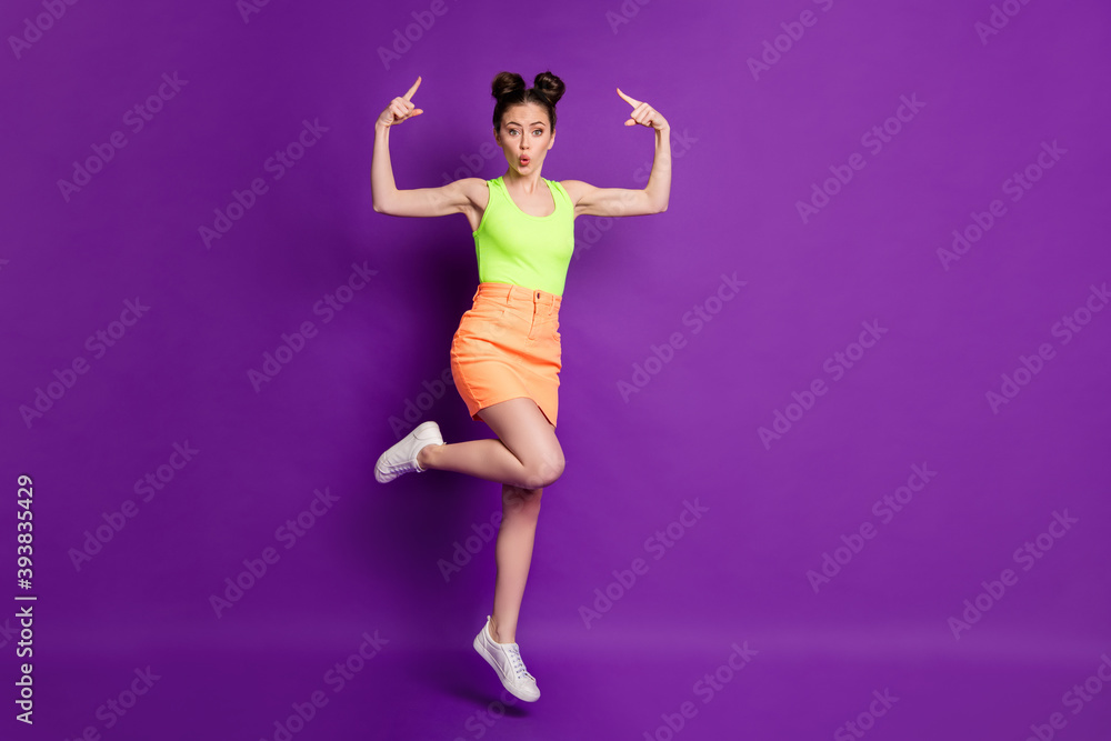 Full length body size view of pretty fit funky cheery girl jumping demonstrating new coiffure pout lips isolated on bright violet color background Full length body size view of pretty fit funky cheery girl jumping demonstrating new coiffure pout lips isolated on bright violet color background