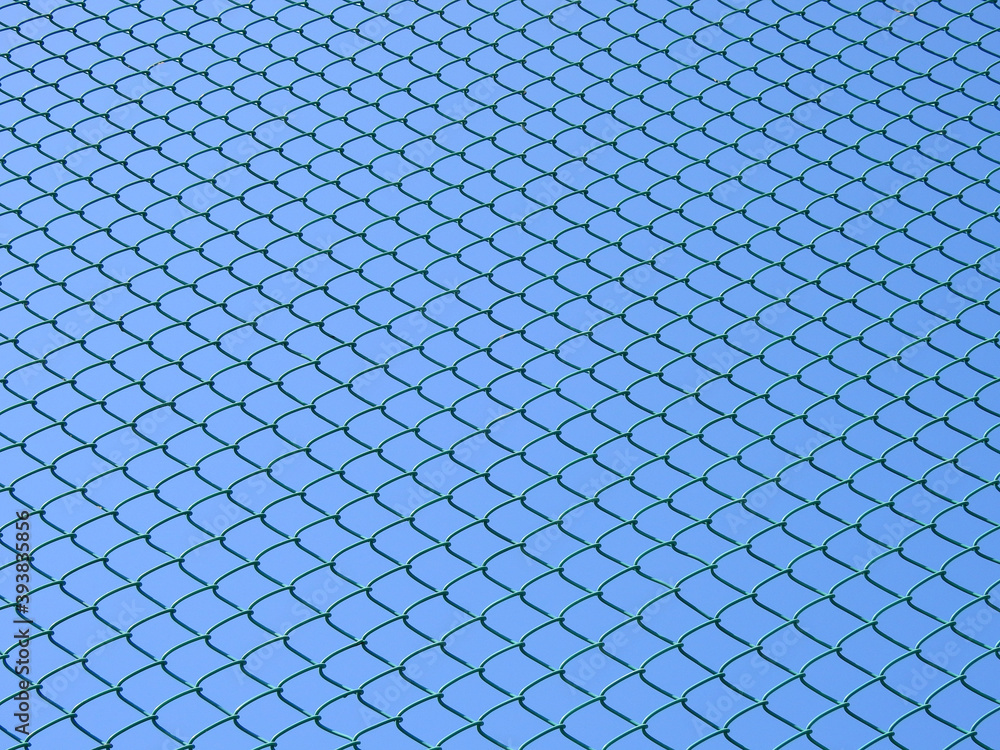 wire mesh of fence with blue sky background wire mesh of fence with blue sky background