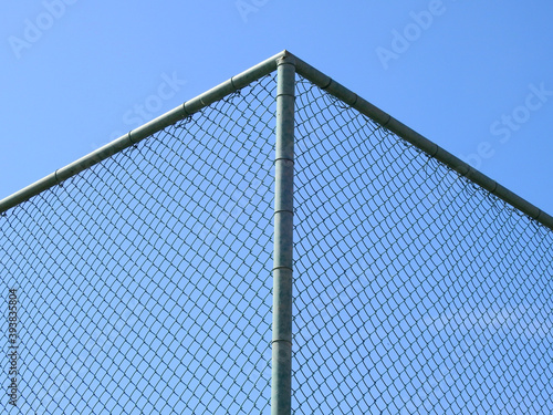 wire mesh of fence with blue sky background