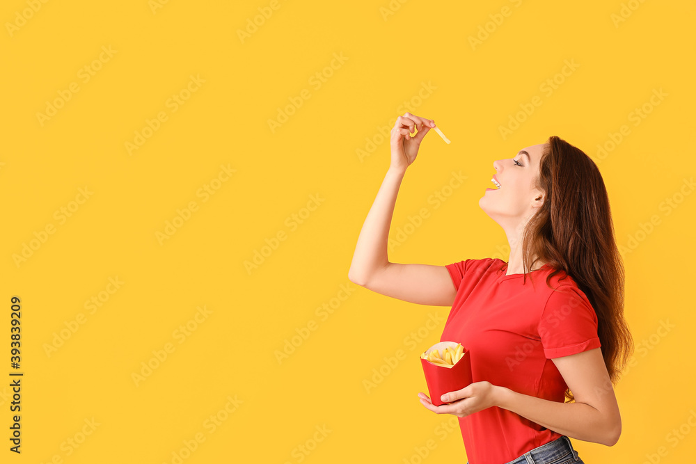 Young woman with french fries on color background Young woman with french fries on color background