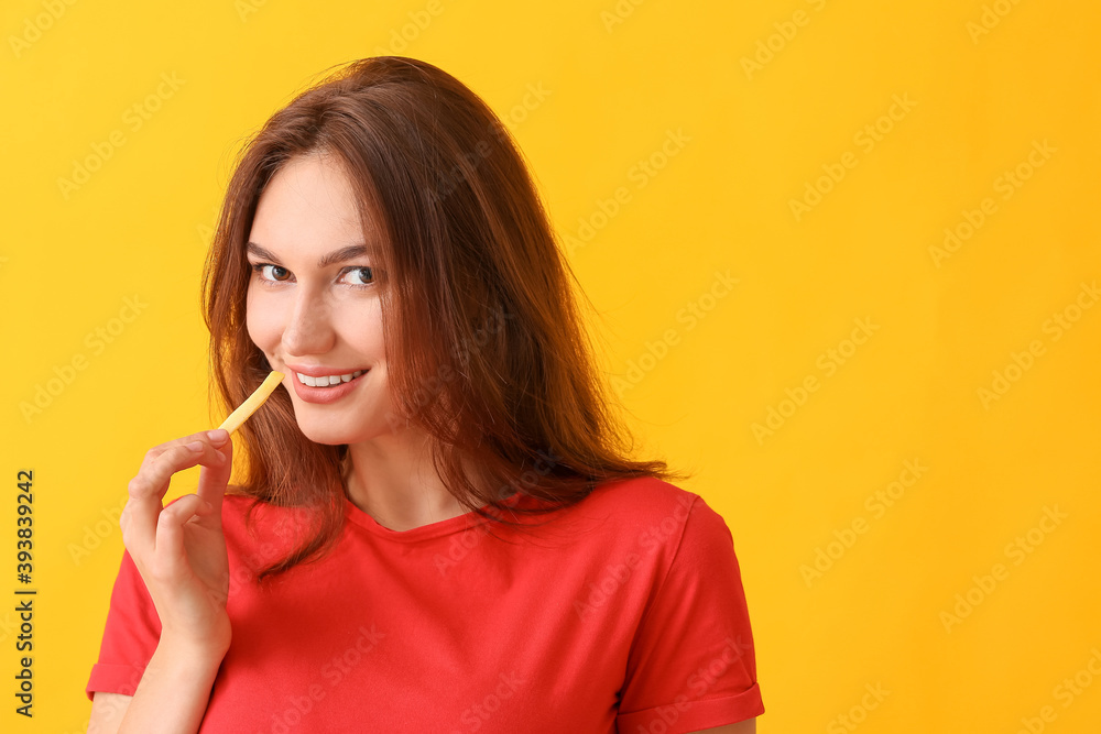 Young woman with french fries on color background Young woman with french fries on color background