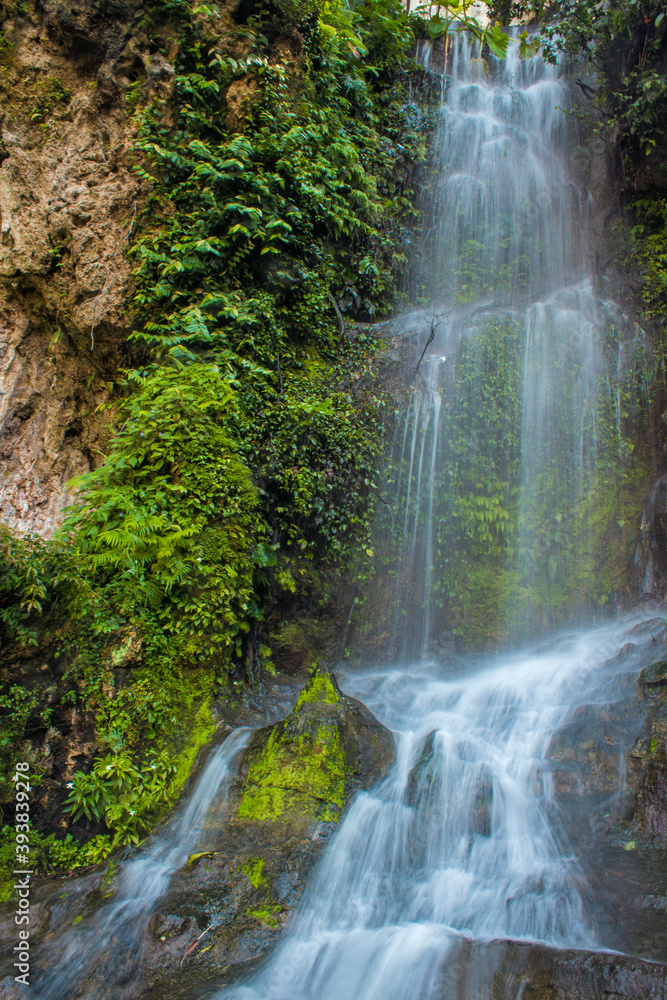 Little green forest waterfall near the Batu Cave Mountains in Kuala Lumpur, capital of Malaysia Little green forest waterfall near the Batu Cave Mountains in Kuala Lumpur, capital of Malaysia