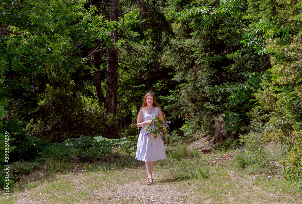 Young girl with a wreath of wild flowers Young girl with a wreath of wild flowers