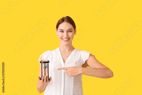 Young woman with hourglass ...