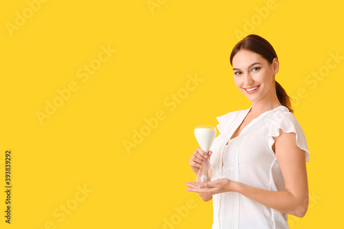 Young woman with hourglass ...