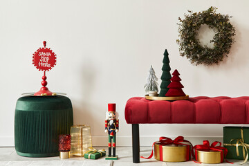 Christmas composition with decoration, christmas tree, gifts, snow and accessories in cozy home decor. Copy space. White and red. Template.