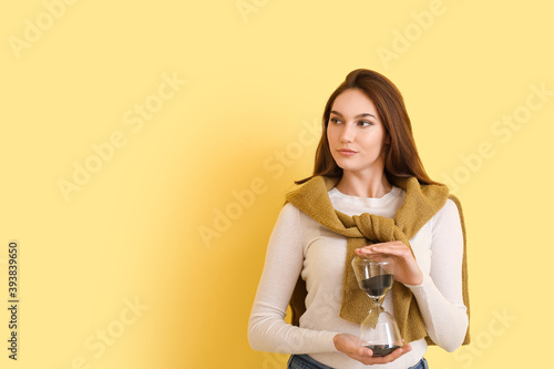 Young woman with hourglass ...