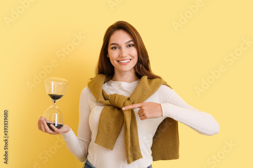 Young woman with hourglass ...