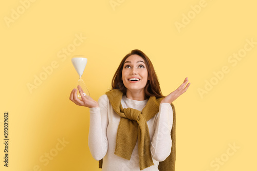 Happy young woman with hour...