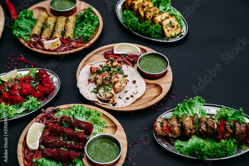 Indian cuisine dishes on black background