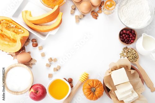 Frame made of ingredients for preparing pumpkin pie on white background