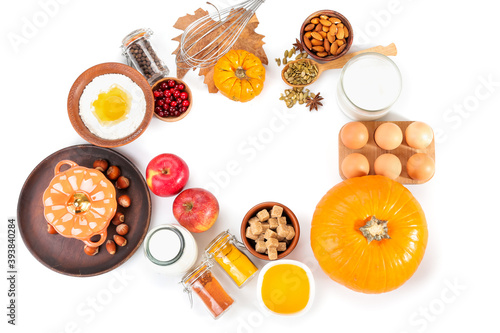 Frame made of ingredients for preparing pumpkin pie on white background