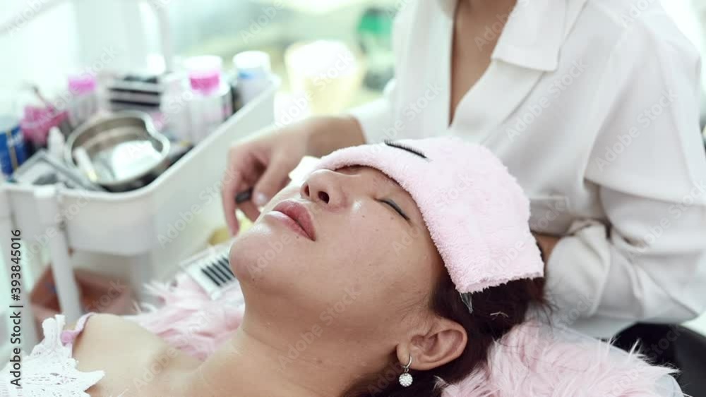 Close-up of clients' faces and eyebrows specialist, process of shaping and coating the eyebrows of women in a beauty salon, Professional queuing. Close-up of clients' faces and eyebrows specialist, process of shaping and coating the eyebrows of women in a beauty salon, Professional queuing.