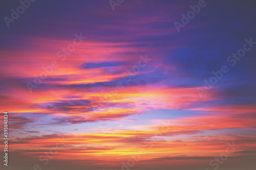 Colorful blazing cloudy sky at sunset. Gradient color. Sky texture, abstract nature background © vvvita