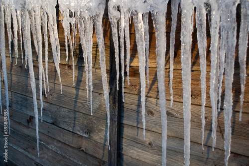 icicles on the roof of a shed 