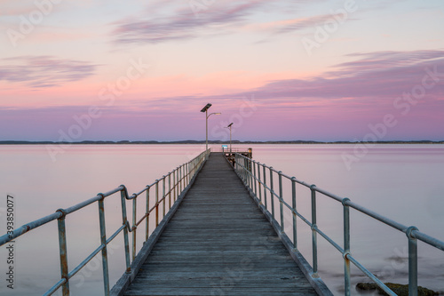 A long exposure pastel sunset over the Robe wooden jetty lcoated in Robe South Australia on November 9th 2020