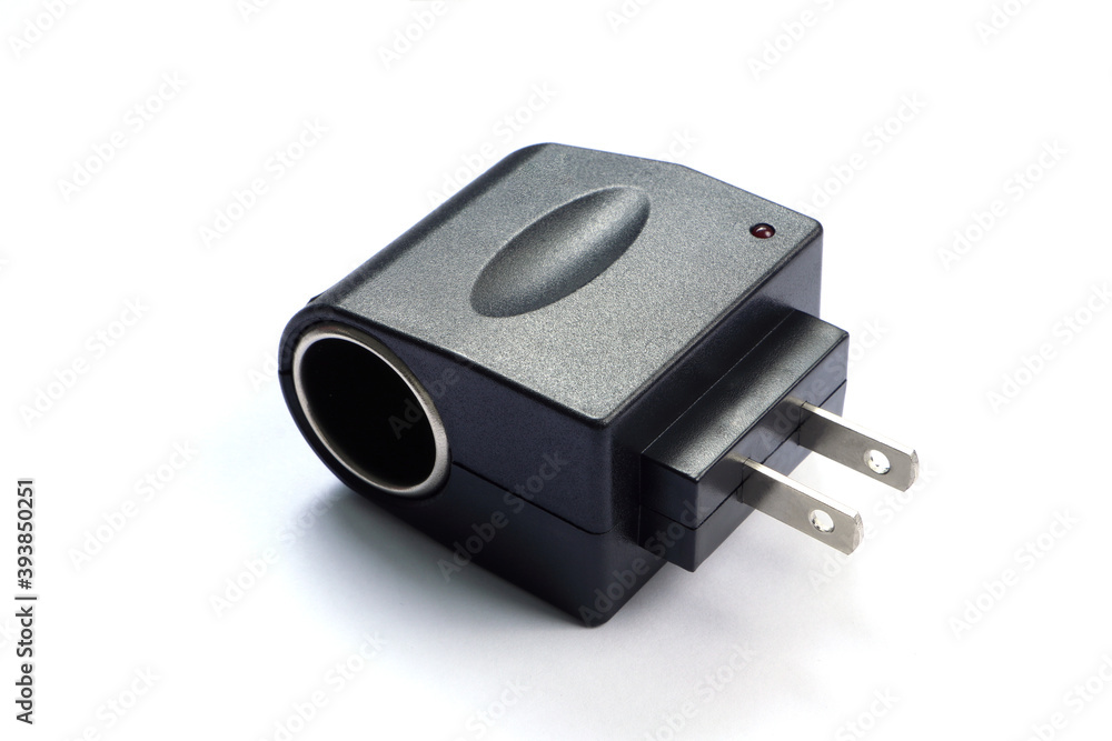 AC to DC adapter plug electric power changer converter 110V AC to DC 12V Converter with Car Adapter Socket isolated on white background AC to DC adapter plug electric power changer converter 110V AC to DC 12V Converter with Car Adapter Socket isolated on white background