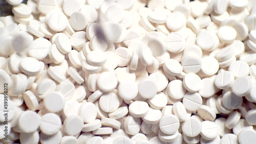 white pills close up.drugs on the production line.top view white pills close up.drugs on the production line.top view
