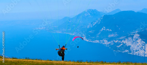 Paragliding over Lake Garda from Monte Baldo mountain. Panoramic view of Lago di Garda, Veneto region of Italy