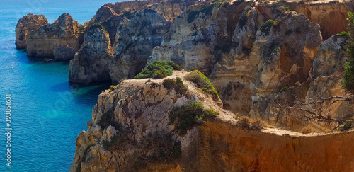 The beauty of Portugal - hiking the wild cliffs in Lagos at the blue Atlantic ocean in Portugal