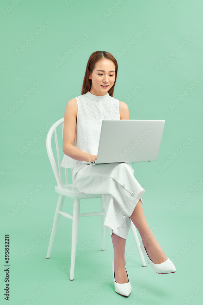 Beautiful and happy woman working with a laptop Beautiful and happy woman working with a laptop