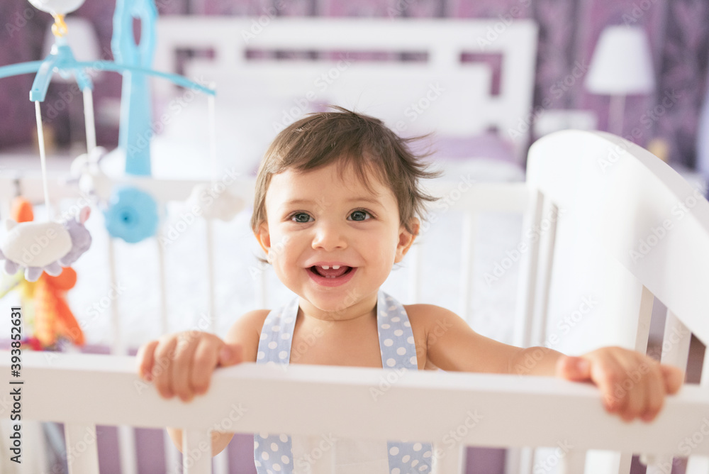 adorable toddler one year old in bedroom crib adorable toddler one year old in bedroom crib