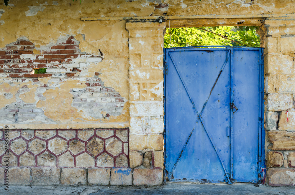 Large blue metal entrance gate 