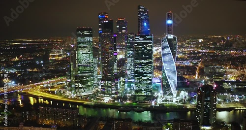 Aerial top view of the illuminated night city in Moscow, Russia