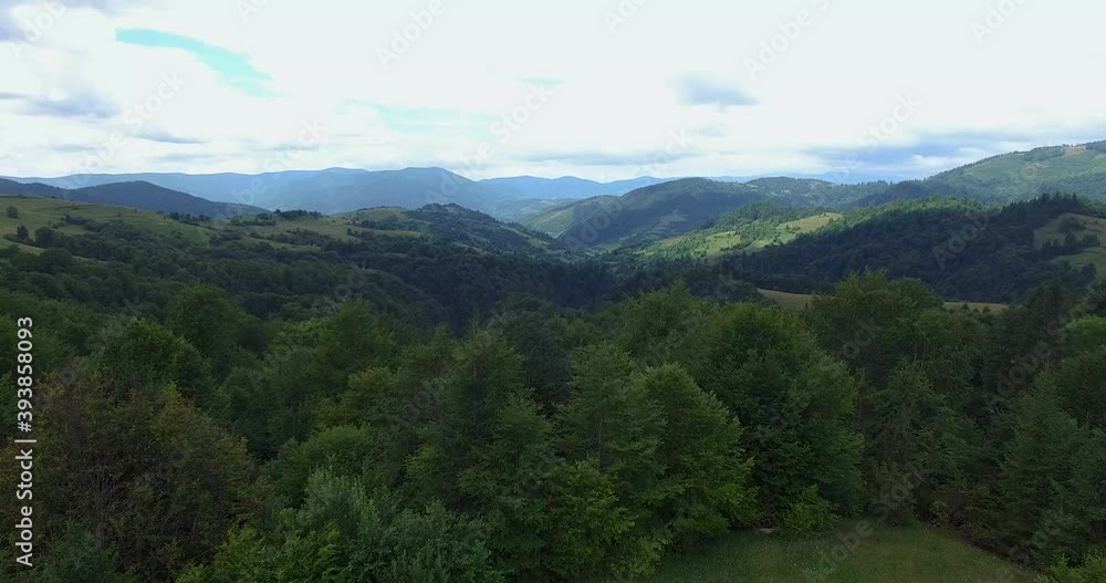 Aerial drone view of the mountain lake Synevyr in the Carpathians, Ukraine. The Carpathian mountains are covered with spruce forest and a lake among the mountains. Aerial drone view of the mountain lake Synevyr in the Carpathians, Ukraine. The Carpathian mountains are covered with spruce forest and a lake among the mountains.