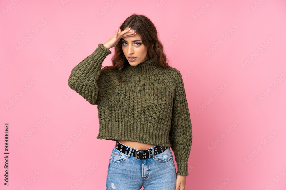 Young woman over isolated pink background looking far away with hand to look something Young woman over isolated pink background looking far away with hand to look something