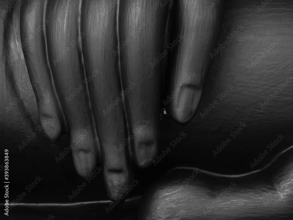 Fototapeta premium hand of black buddha statue