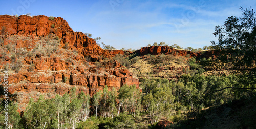 Hiking and swimming in Karijini National-Park, Western Australia with beautiful rock formations photo