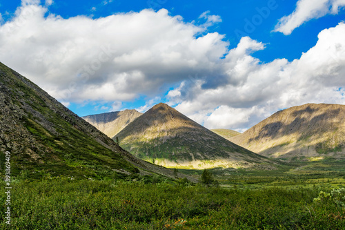 valley and mountains in the subpolar urals on a summer day