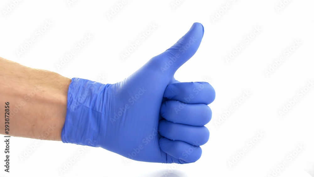 Thumbs Up Signal Shown in Blue Protective Surgical Gloves on White Background Thumbs Up Signal Shown in Blue Protective Surgical Gloves on White Background