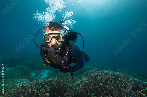 Scuba diver exploreds coral reef.  © frantisek hojdysz