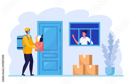 Safe contactless delivery to home. Courier in face protective mask with grocery products bag near the door. Quarantine rules