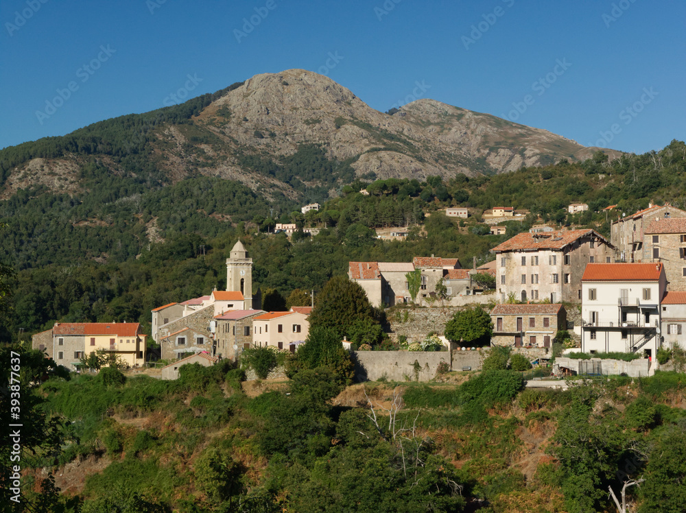 View on a tiny village with its bell tower in the mountains
