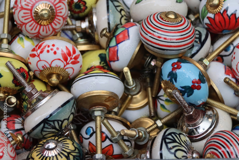 Collection of old fashioned vintage door knobs on display in a market