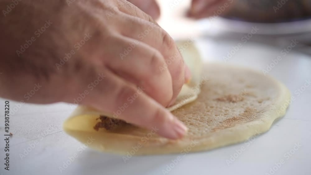 Chef prepares Russian national dish pancakes stuffed with meat Chef prepares Russian national dish pancakes stuffed with meat