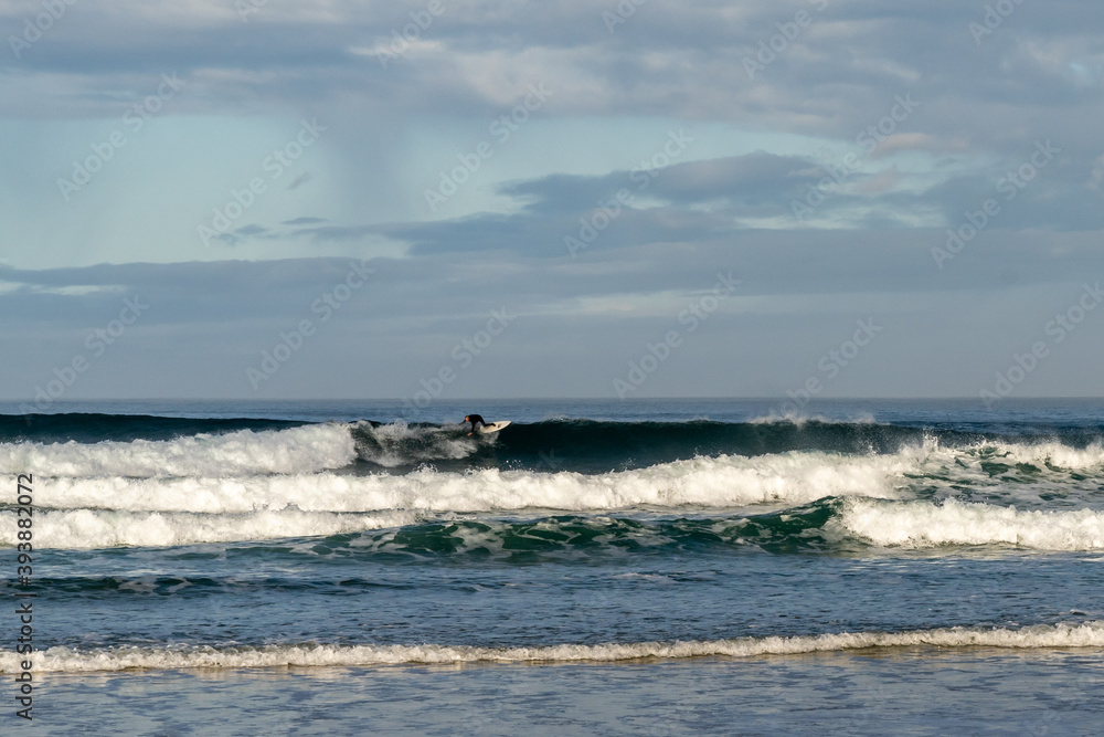 surfing at A Frouxeira beach in Galicia in northern Spain