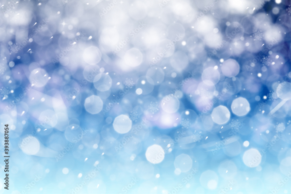 Abstract snowfall on blue background, bokeh effect