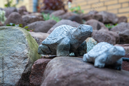 Stone turtle on the move in the garden