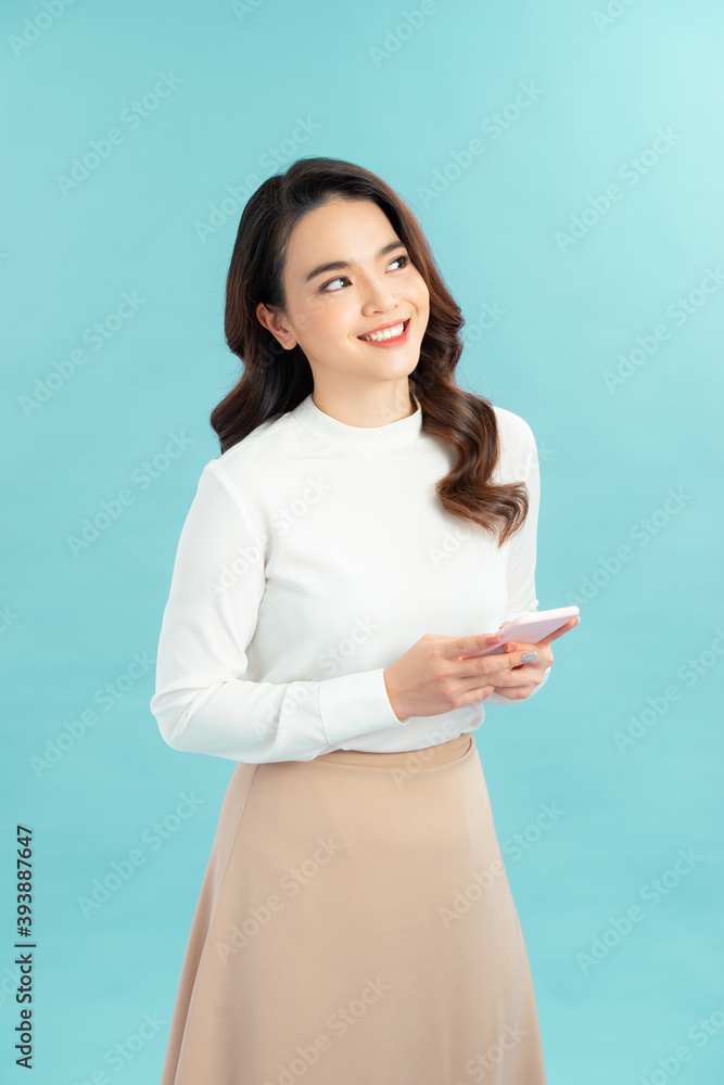 Photo of cheerful cute beautiful young woman chatting by mobile phone Photo of cheerful cute beautiful young woman chatting by mobile phone