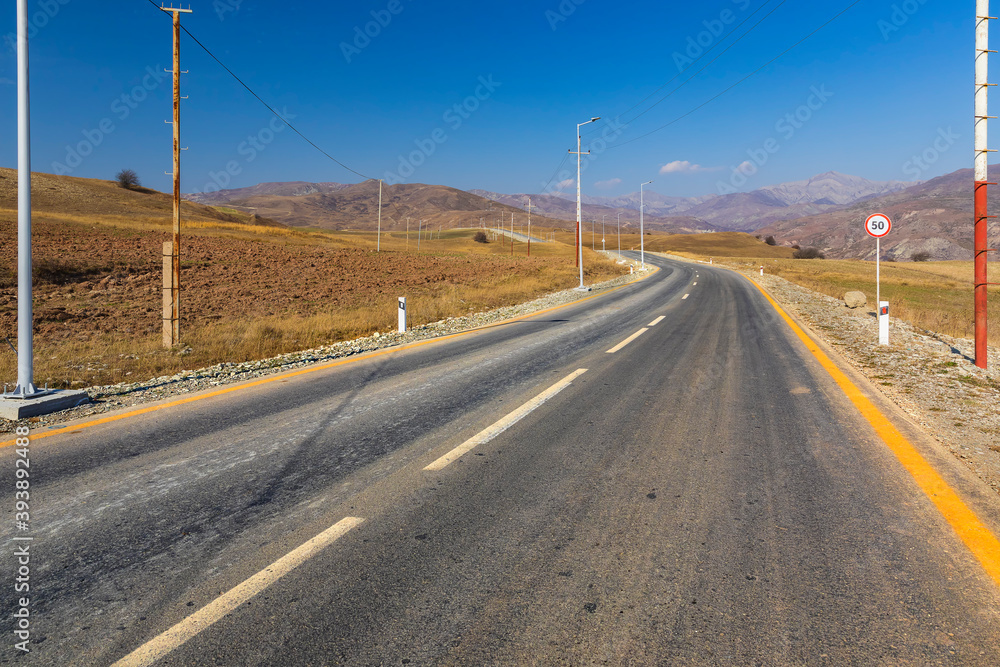 Asphalt road leading to the mountains Asphalt road leading to the mountains