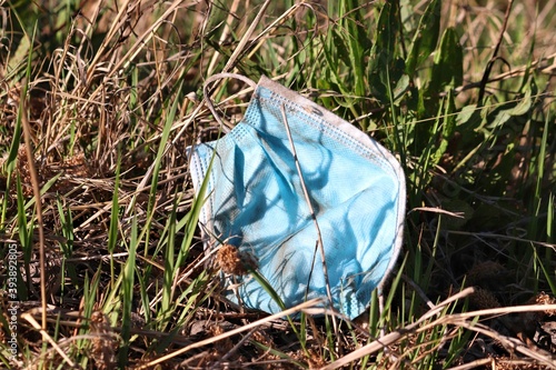 Abandoned blue surgical face mask - typical view during coronavirus epidemic. Katowice, Poland.